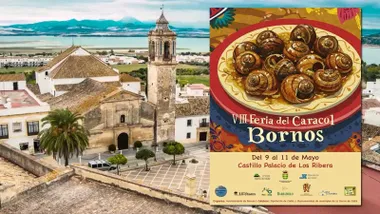 Iglesia de Bornos, al fondo el lago y a la derecha el cartel de la VIII Feria, destaca por un plano de caracoles pintado.