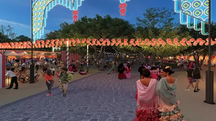 Personas paseando por una calle iluminada de la Feria del Carmen de San Fernando.