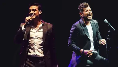 Los cantantes Carlos Rivera y Pablo López en un fondo negro.