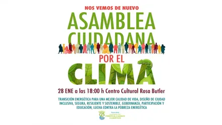 Cartel anunciador con letras verdes de la Asamblea por el Clima en Puerto Real.