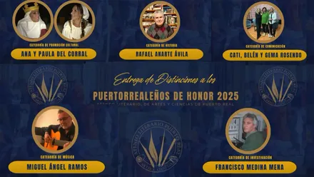 Cartel con los galardonados como 'Puertorrealeños de Honor'.