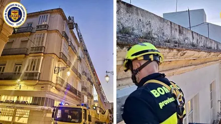 Camión de bomberos en la calle afectada y bombero trabajando en la cornisa.